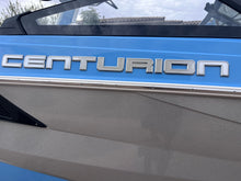 Load image into Gallery viewer, Close-up of a vehicle with &#39;Centurion&#39; branding on a blue and gray background.
